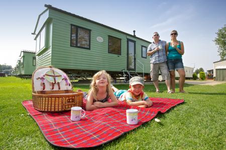 Family outside Billing Caravan