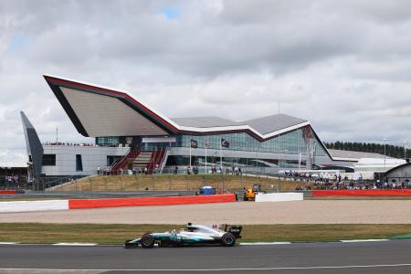 Lewis Hamilton driving around Silverstone Circuit