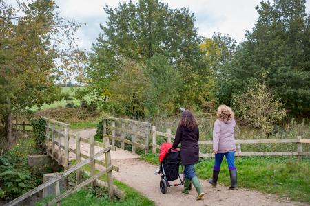 Ladies with a pram taking a leisurely stroll