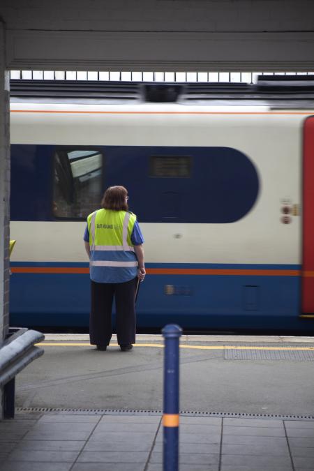 Train worker standing on station's platform